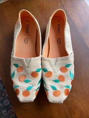 TOMS Women's Cream Canvas Slip-Ons with Orange & Teal Embroidery